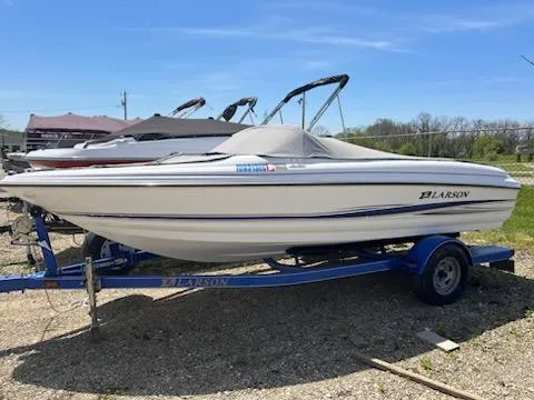 Slide: The Image of 2006 Larson 180 Bowrider SEI on trailer, covered, parked outdoors. - 1