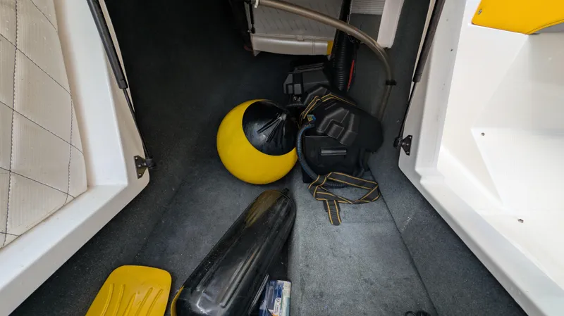 Slide: The Image of Interior of 2013 MasterCraft X2 boat with yellow and black accessories. - 25