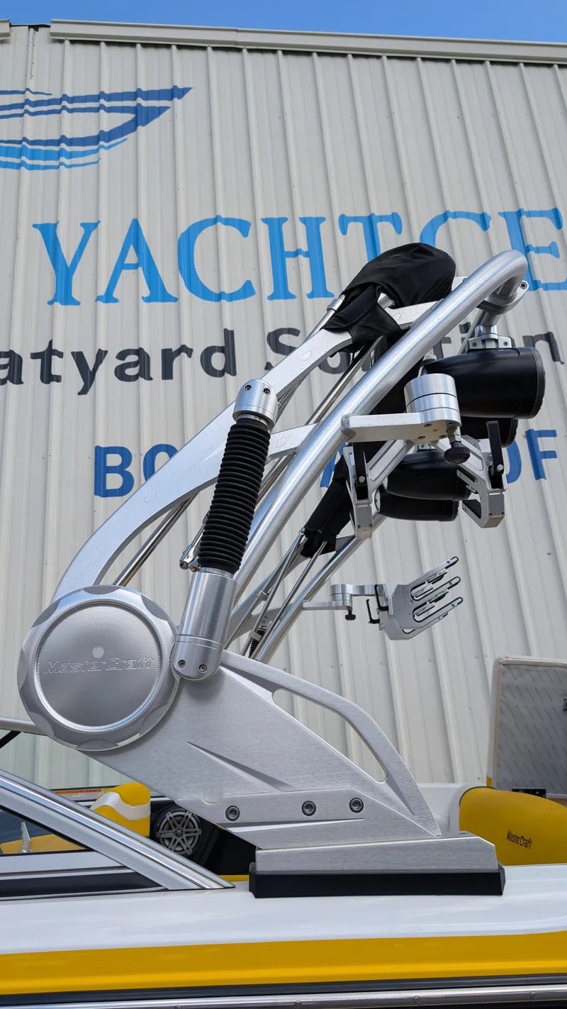 Slide: The Image of 2013 MasterCraft X2 boat with wakeboard tower at a boatyard. - 26