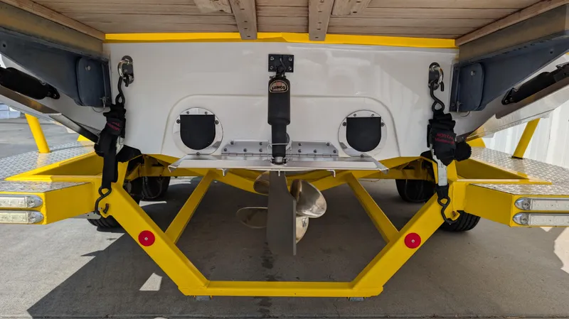 Slide: The Image of Rear view of a 2013 MasterCraft X2 boat on a yellow trailer. - 5