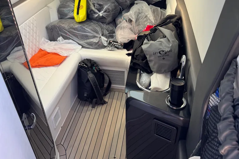 Slide: The Image of Interior of 2022 Nor-Tech 450 Sport Center Console with seating and storage bags. - 13