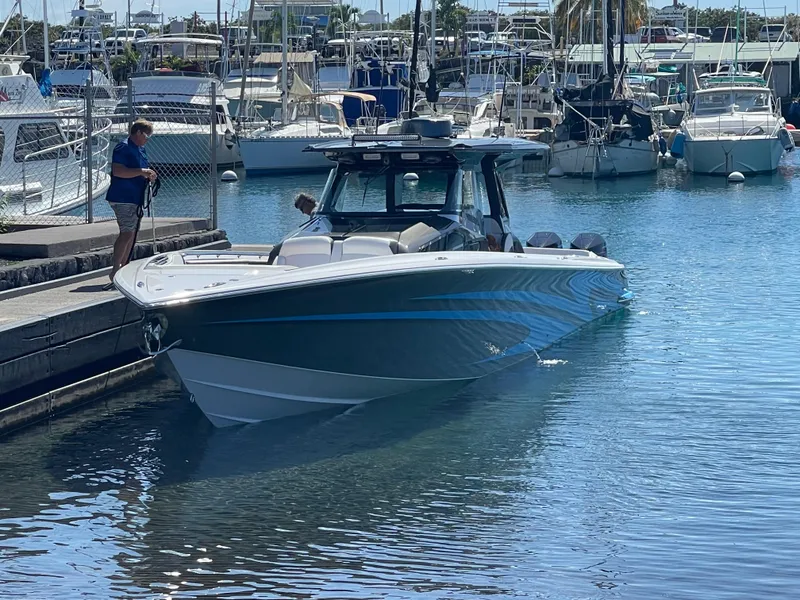 Slide: The Image of 2022 Nor-Tech 450 Sport Center Console docked at a marina. - 19