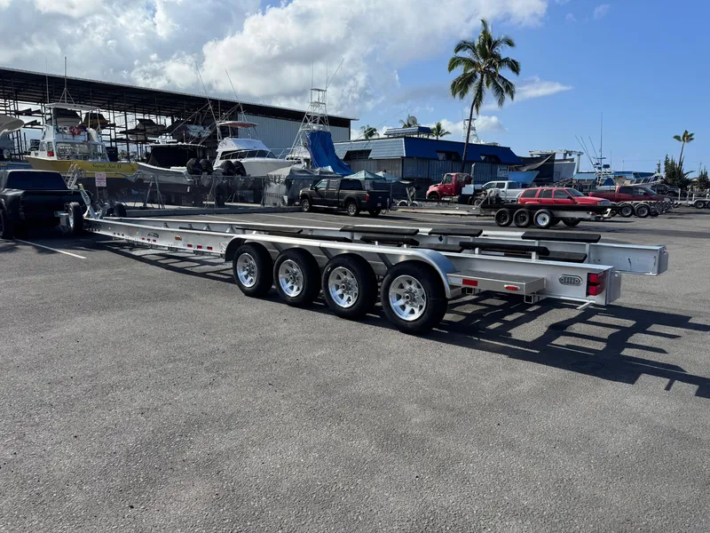 Slide: The Image of Trailer for 2022 Nor-Tech 450 Sport Center Console in a marina parking lot. - 26