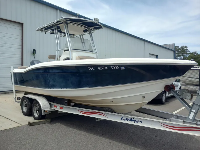 Slide: The Image of 2005 Scout 205 Sportfish boat dashboard with steering wheel and controls. - 10