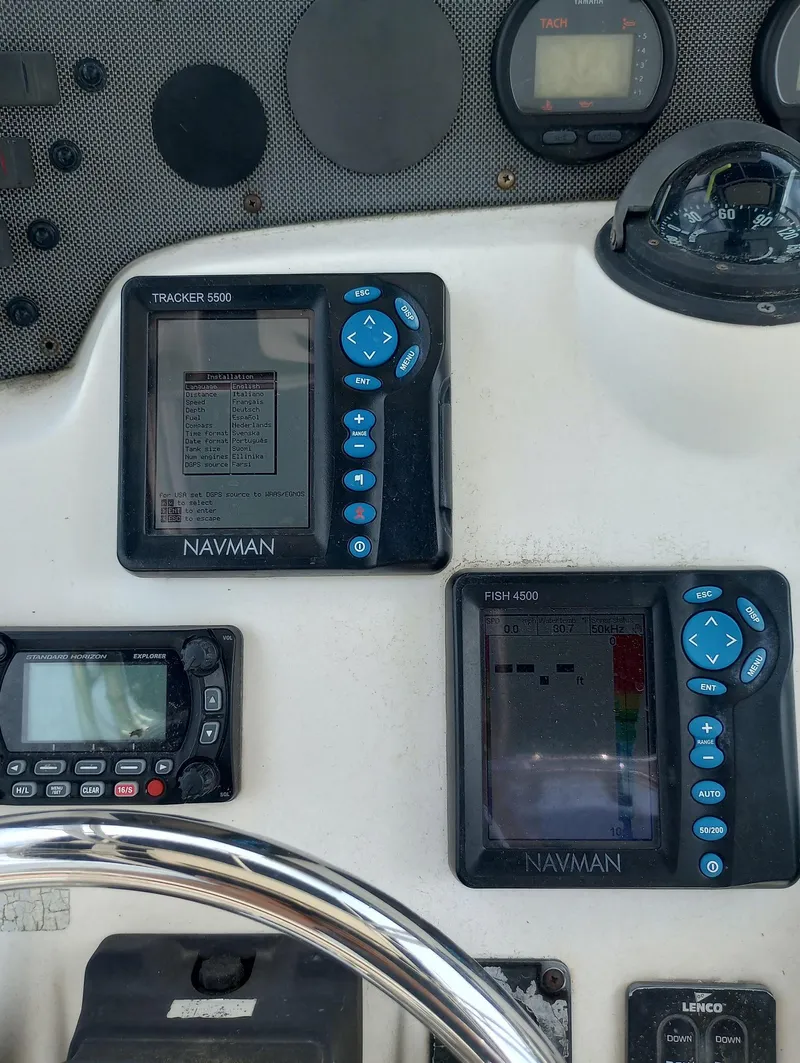 Slide: The Image of Dashboard of a 2005 Scout 205 Sportfish with Navman electronics. - 14