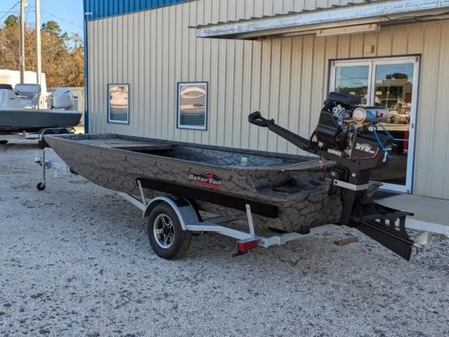 Slide: The Image of 2025 Gator Tail 1754 Extreme Series boat on trailer outside a building. - 4