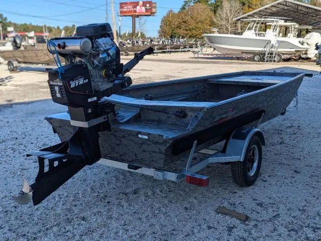 Slide: The Image of 2025 Gator Tail 1754 Extreme Series boat with trailer, parked outdoors. - 5