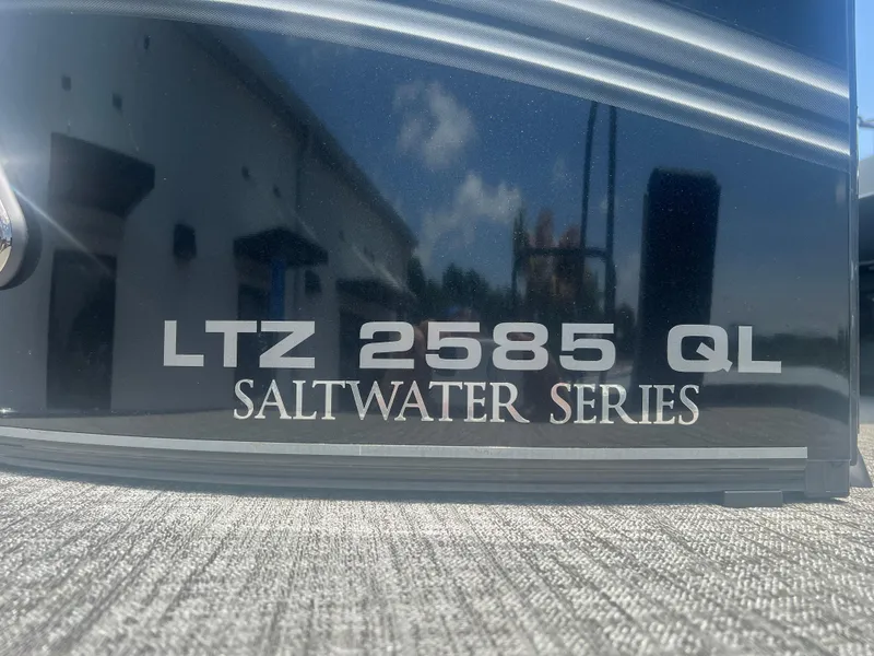Slide: The Image of 2025 Tahoe LTZ QL25T Saltwater Series boat, close-up view of model name. - 25