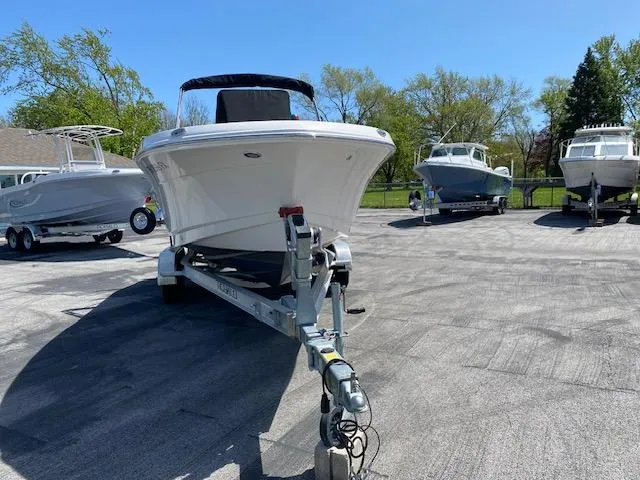 Slide: The Image of 2019 Robalo R200 Center Console boat on trailer in outdoor lot. - 2