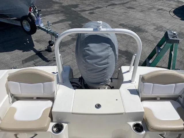 Slide: The Image of 2019 Robalo R200 Center Console boat with covered engine and seating. - 8