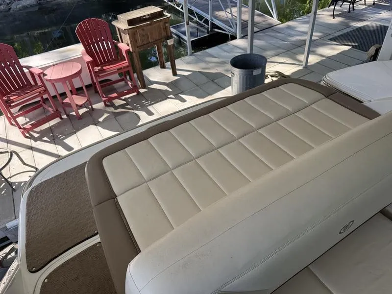 Slide: The Image of 2010 Cobalt 302 boat dashboard with steering wheel and instrument panel. - 17