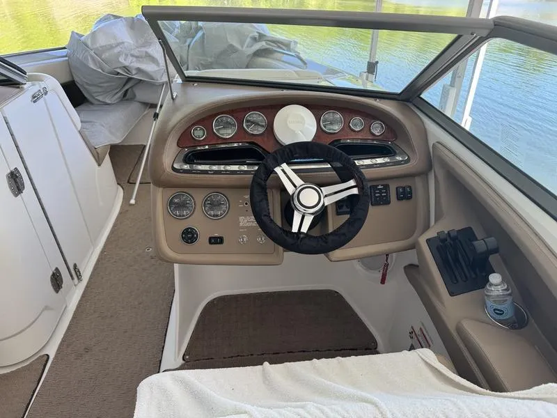 Slide: The Image of Compact marine bathroom in 2010 Cobalt 302 boat, featuring a toilet and storage space. - 18