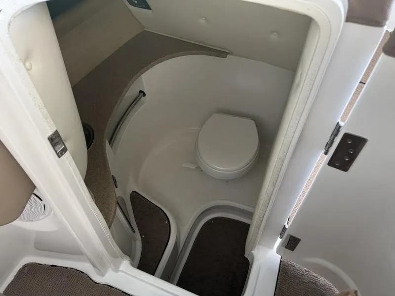 Slide: The Image of 2010 Cobalt 302 boat engine, featuring a Volvo Penta motor, in a clean engine compartment. - 19