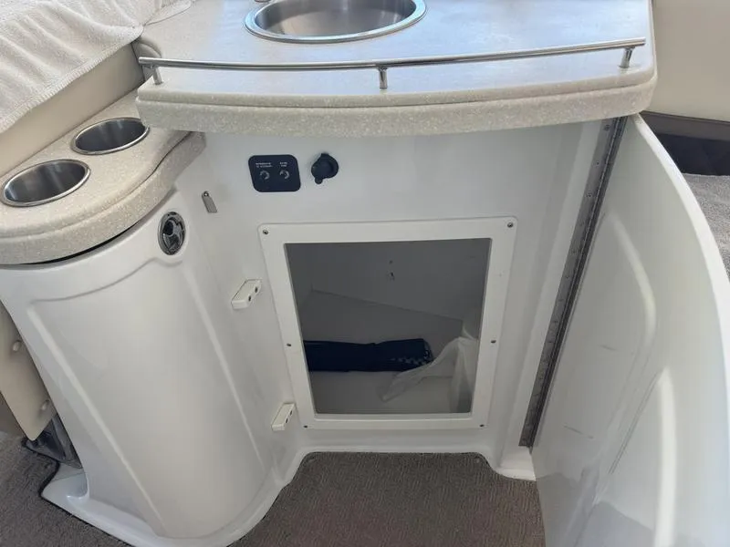 Slide: The Image of Storage compartment in 2010 Cobalt 302 boat with life jackets and safety equipment. - 21