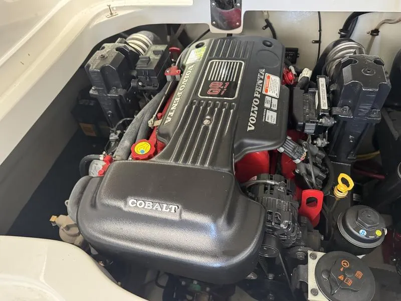 Slide: The Image of Storage compartment in a 2010 Cobalt 302 boat with life jackets and safety gear. - 7