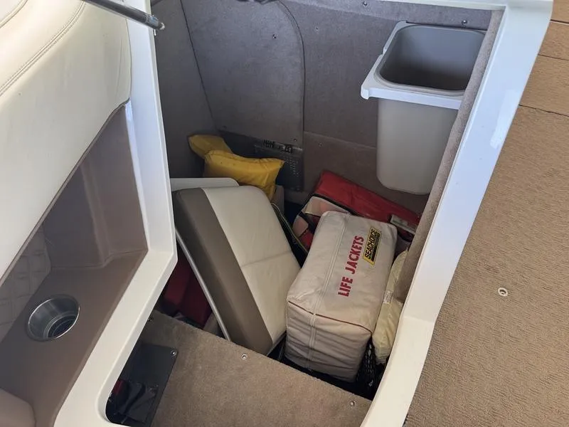 Slide: The Image of 2010 Cobalt 302 boat interior with sink and storage compartment. - 8