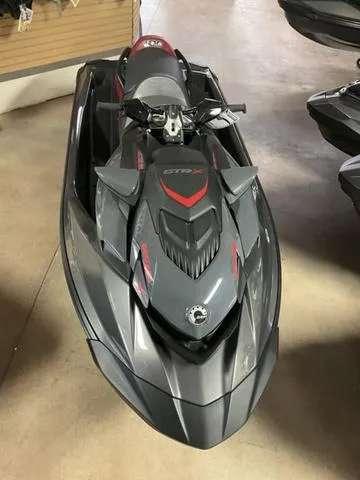 Slide: The Image of 2024 Sea-Doo Waverunner GTR-X 300 IBR in showroom, sleek gray design. - 4