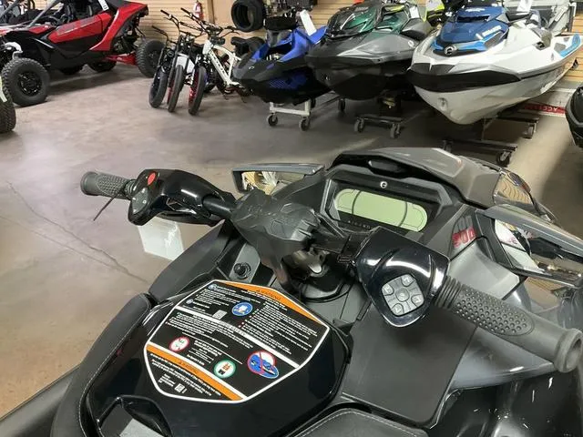 Slide: The Image of 2024 Sea-Doo Waverunner GTR-X 300 IBR in showroom, featuring handlebars and control panel. - 5
