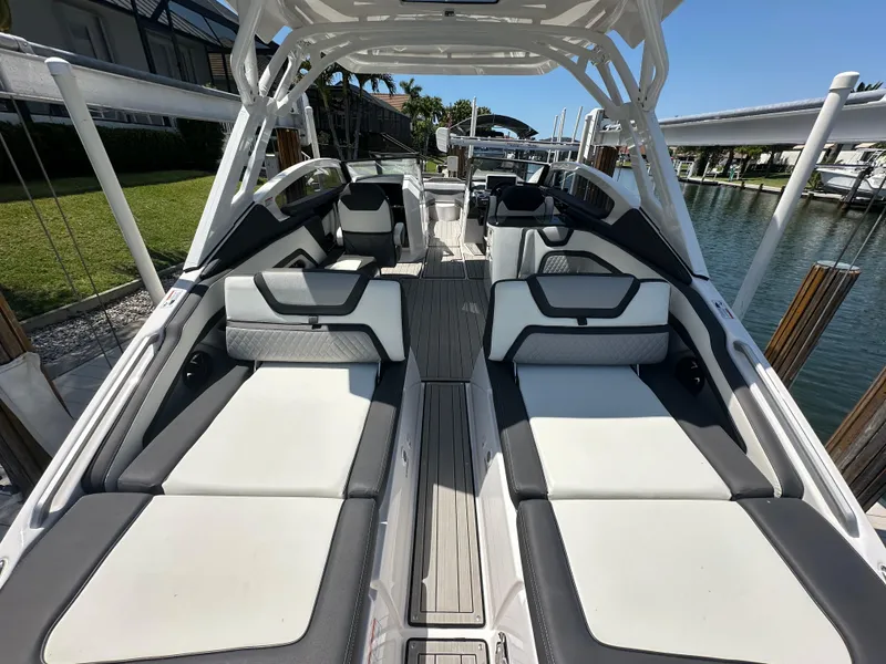 Slide: The Image of 2023 Yamaha Boats 275 SDX interior with sleek seating and modern design. - 19