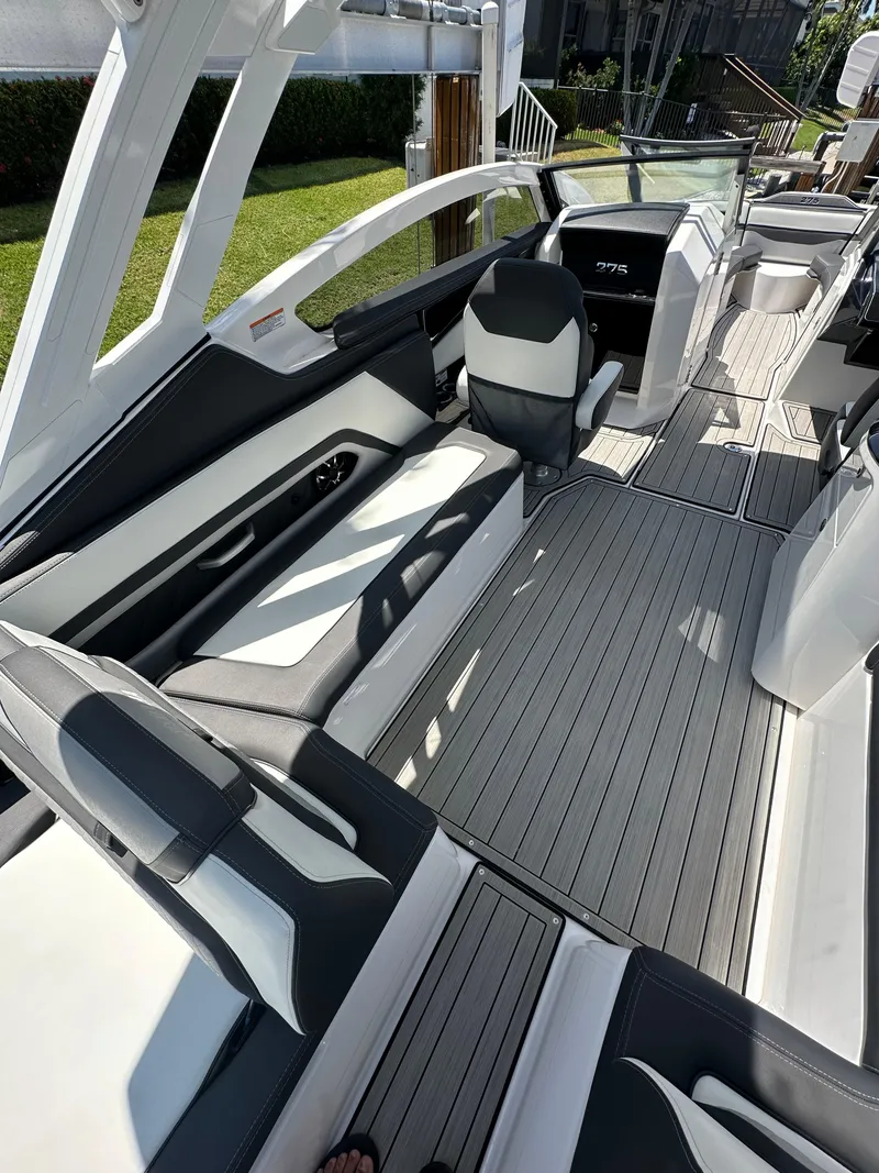 Slide: The Image of 2023 Yamaha Boats 275 SDX interior with sleek seating and modern design. - 20
