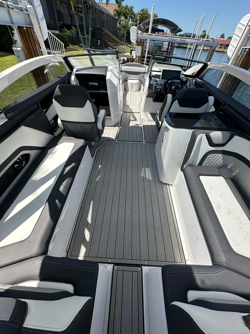 Slide: The Image of 2023 Yamaha Boats 275 SDX interior with sleek seating and modern design. - 21