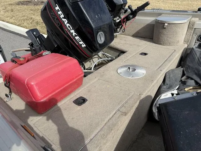 Slide: The Image of 2002 Tracker 185 Targa boat interior with motor and red fuel tank. - 5