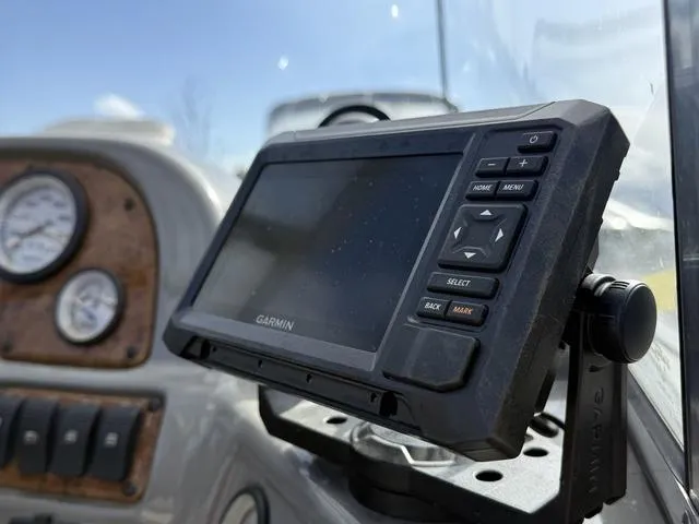 Slide: The Image of Garmin GPS device on 2002 Tracker 185 Targa boat dashboard with gauges. - 7