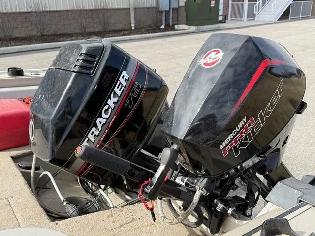 Slide: The Image of 2002 Tracker 185 Targa boat with Tracker 75 and Mercury Kicker outboard motors. - 9