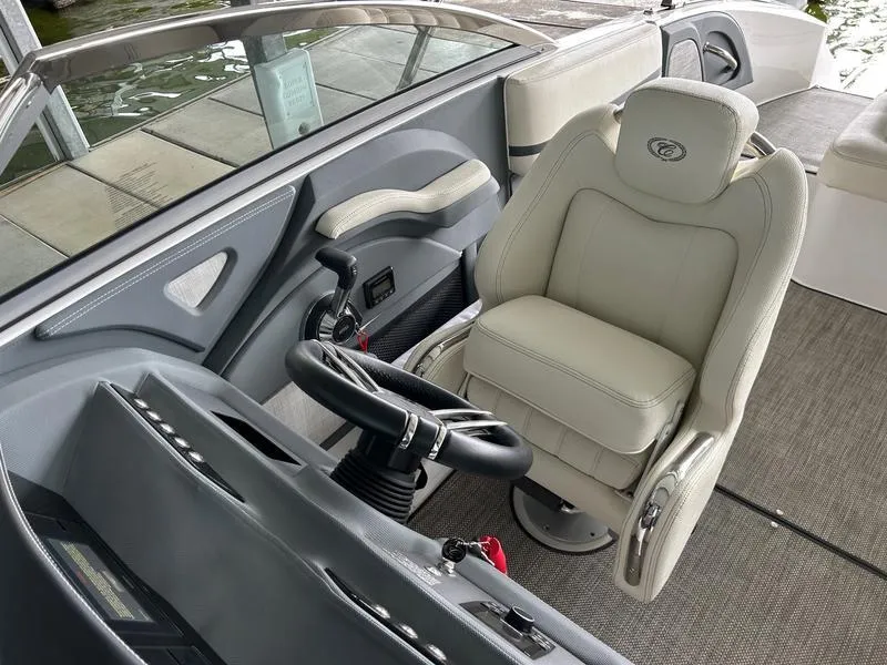 Slide: The Image of 2019 Cobalt R3 boat interior with steering wheel and plush captain's chair. - 12