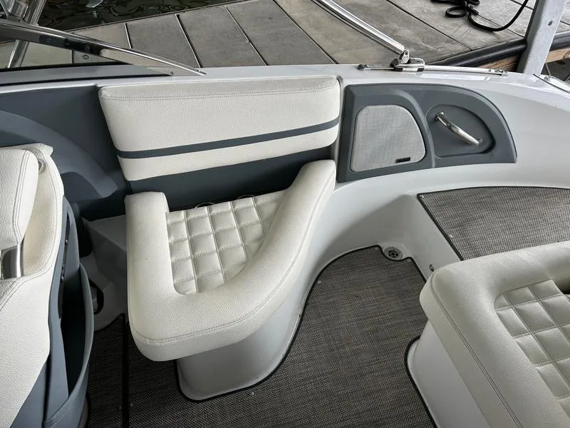 Slide: The Image of 2019 Cobalt R3 boat interior with white cushioned seating and gray accents. - 13