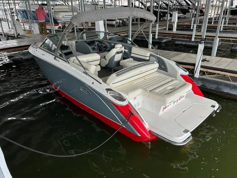 Slide: The Image of 2019 Cobalt R3 boat docked, featuring gray and red exterior with spacious seating. - 5
