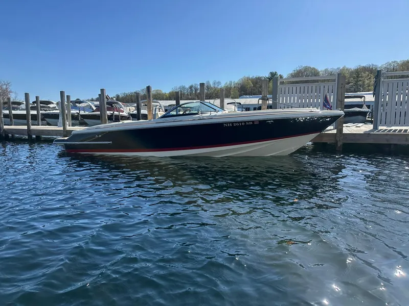 Slide: The Image of 2022 Chris-Craft Launch 23 boat docked on a sunny day. - 1