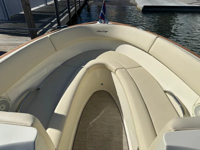 Slide: The Image of 2022 Chris-Craft Launch 23 boat with elegant beige seating and wooden accents. - 14