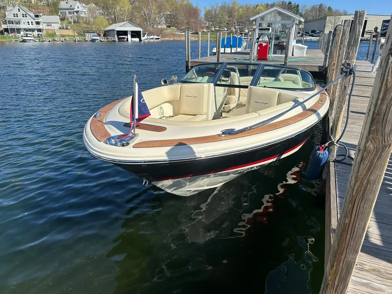 Slide: The Image of 2022 Chris-Craft Launch 23 boat docked on a sunny day by the water. - 5