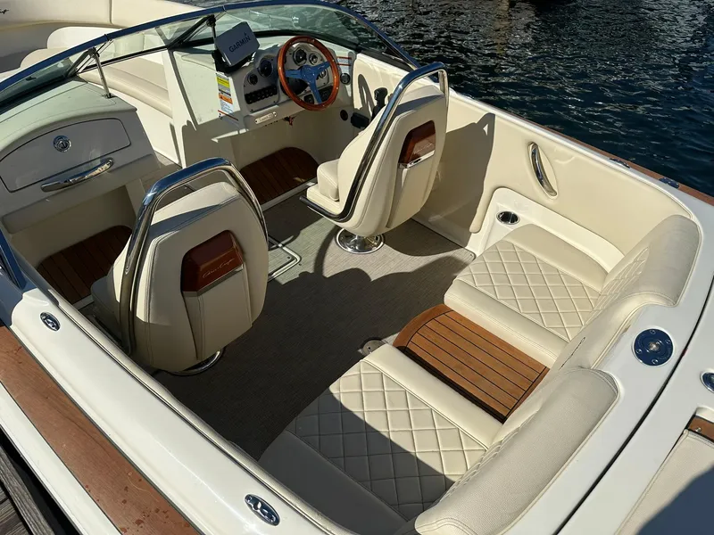 Slide: The Image of 2022 Chris-Craft Launch 23 boat interior with elegant seating and wooden accents. - 8
