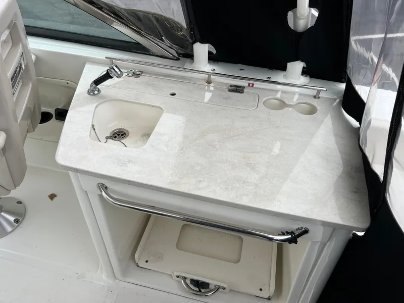 Slide: The Image of 2017 Boston Whaler 270 Vantage boat sink and countertop area. - 4