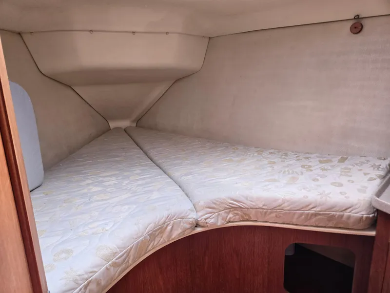 Slide: The Image of Interior cabin of 2002 Hunter 380 sailboat with V-berth bed. - 23