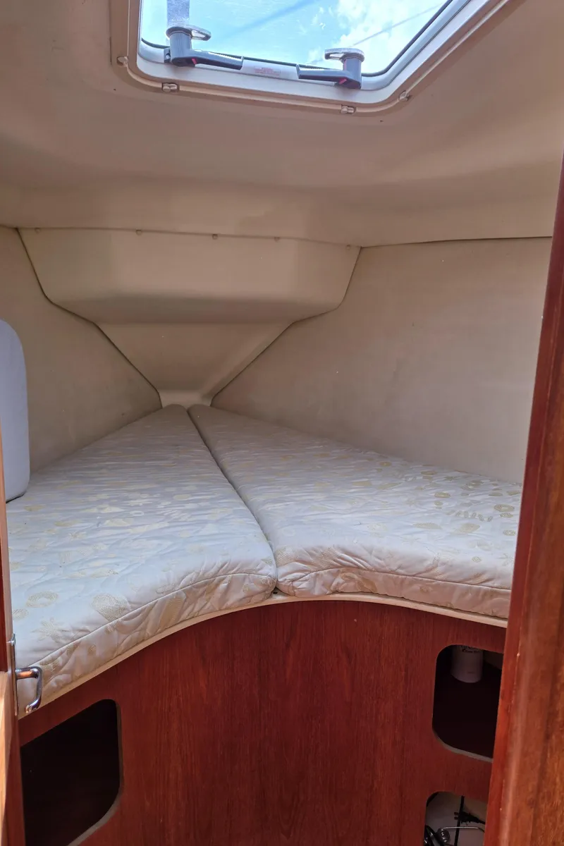 Slide: The Image of Interior cabin of 2002 Hunter 380 sailboat with V-berth and skylight. - 24