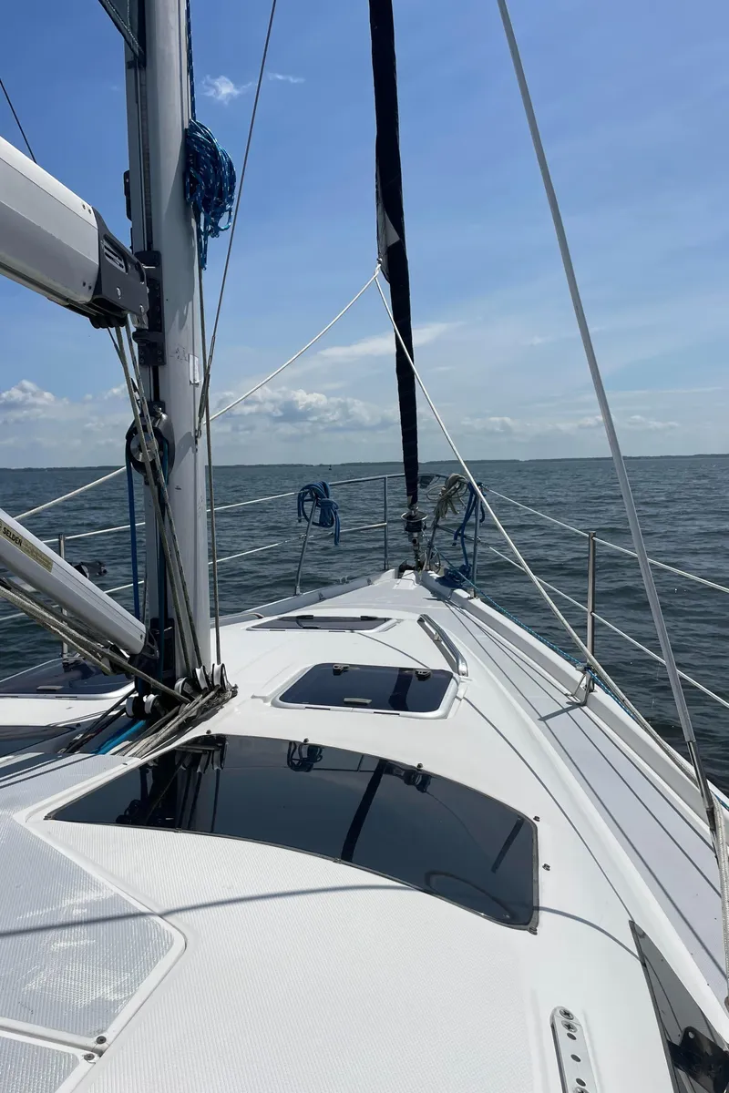 Slide: The Image of Sailing on a 2002 Hunter 380 yacht under clear blue skies. - 27