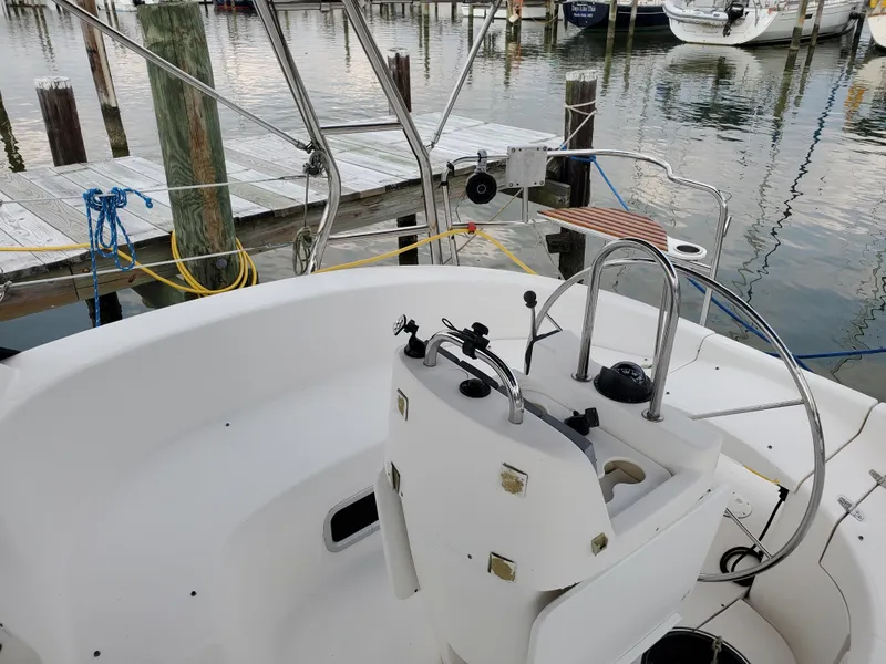 Slide: The Image of Cockpit of a 2002 Hunter 380 sailboat docked at a marina. - 3