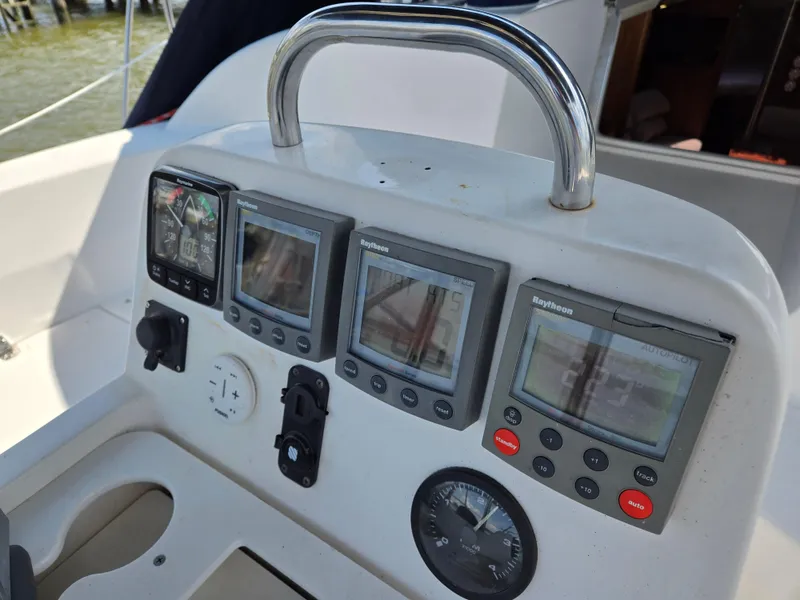 Slide: The Image of Control panel of a 2002 Hunter 380 sailboat with navigation instruments. - 4