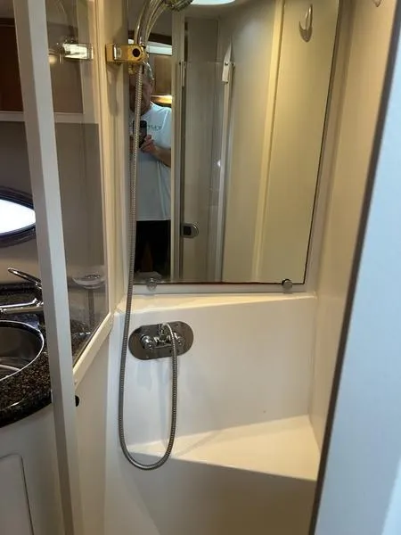 Slide: The Image of Compact bathroom in a 2005 Carver 396 AFT yacht with shower and sink. - 38
