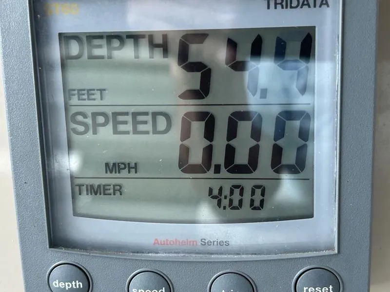 Slide: The Image of Depth gauge reading 54.4 feet, speed 0.00 MPH, timer 4:00, on Carver 396 AFT 2005. - 43