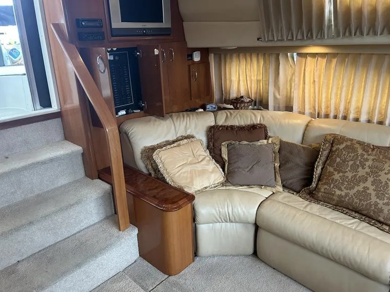 Slide: The Image of Luxurious interior of 2005 Carver 396 AFT yacht with plush seating and elegant decor. - 32