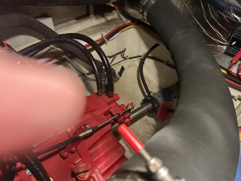 Slide: The Image of Engine compartment of a 2005 Carver 396 AFT with visible hoses and wiring. - 36