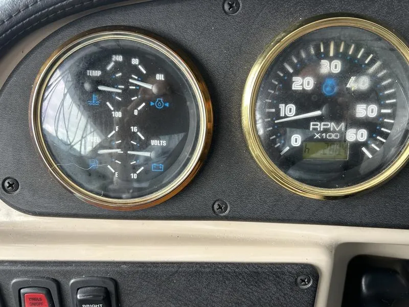 Slide: The Image of Close-up of 2005 Carver 396 AFT boat dashboard gauges, showing RPM and engine metrics. - 46