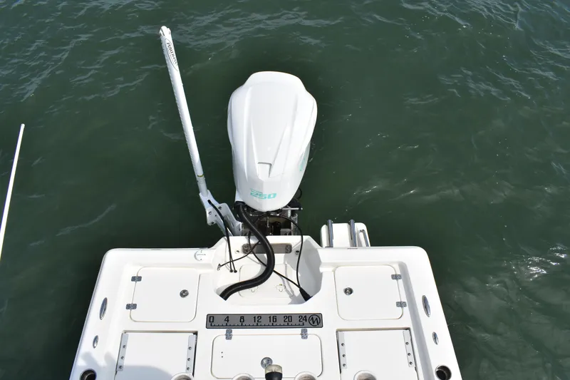 Slide: The Image of 2021 Key West 230 BR boat with outboard motor on water. - 9