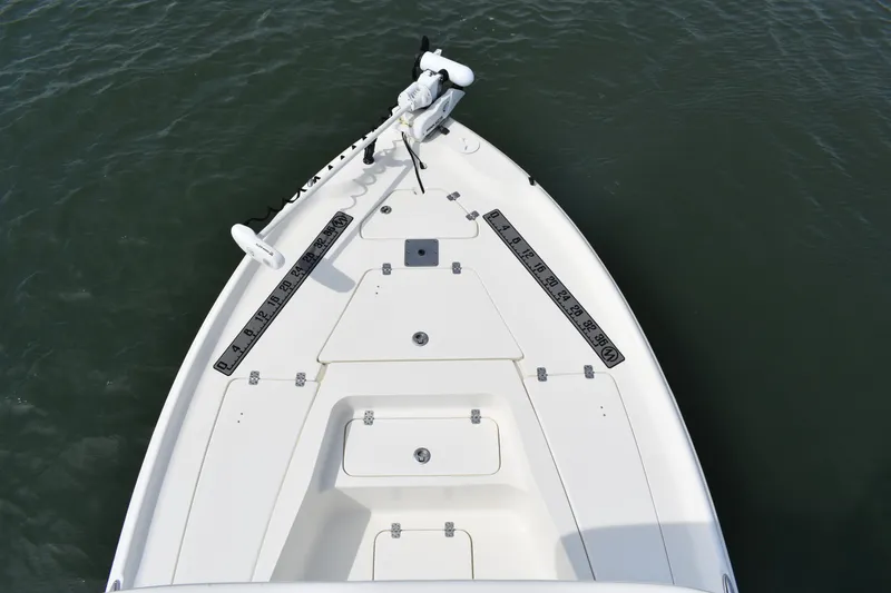 Slide: The Image of 2021 Key West 230 BR boat bow with trolling motor on calm water. - 6