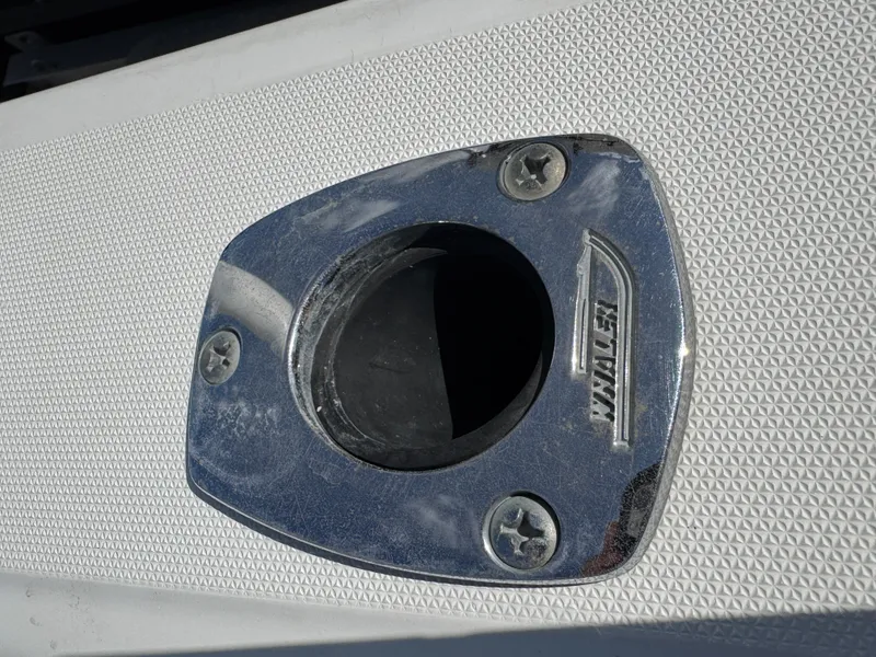 Slide: The Image of Chrome boat fitting on 1999 Boston Whaler Conquest 23 with textured surface. - 37