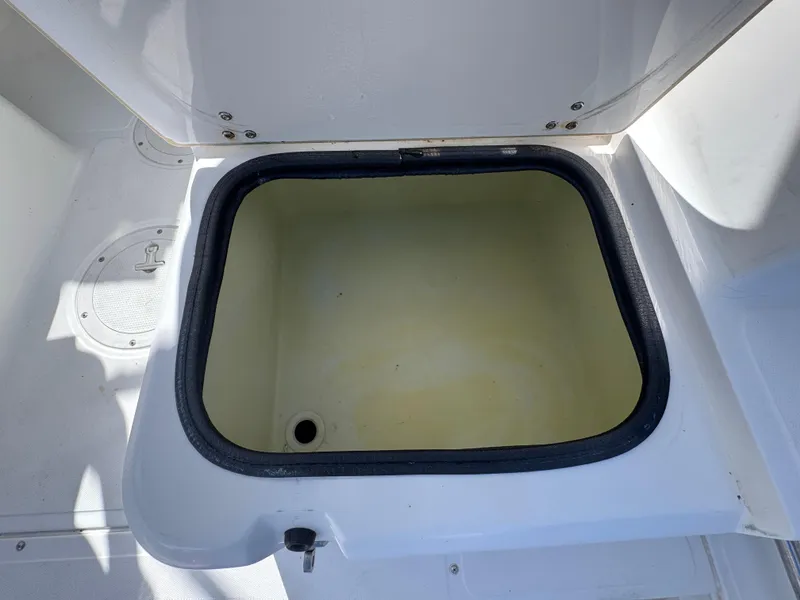 Slide: The Image of Open storage compartment on a 1999 Boston Whaler Conquest 23 boat. - 40